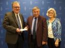 ARRL CEO David Minster, NA2AA (left), accepts funding for the W1YSM Snyder Family Collegiate & ARRL Affiliated Club Endowment Fund from Dr. Ed Snyder, W1YSM, and Rose Snyder. [Alex Norstrom, photo]